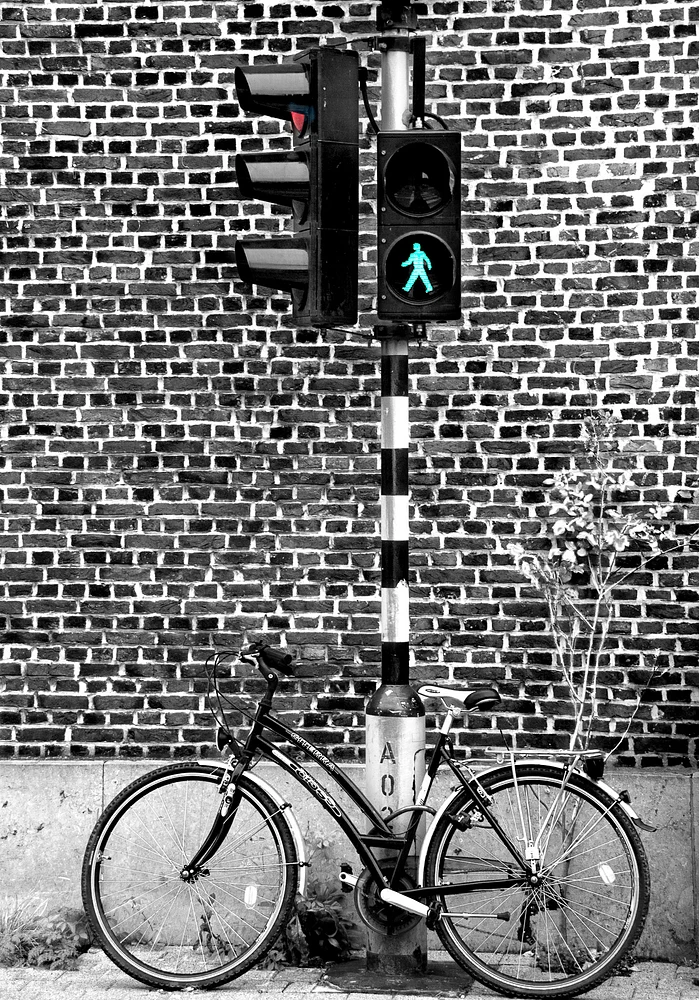 Urban Bicycle at Traffic Light Against Brick Wall