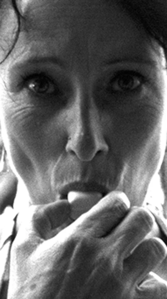 Intense Portrait of a Woman Eating