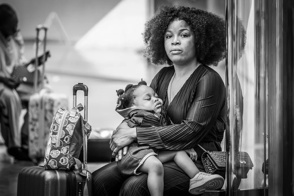 Mother and Child at the Airport: A Moment of Rest