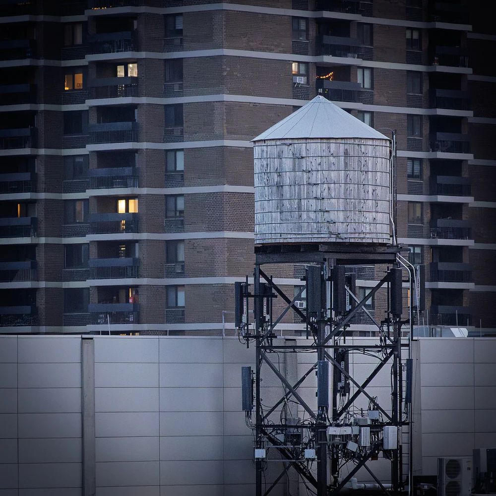 Iconic New York City Water Tower Against Urban Backdrop
