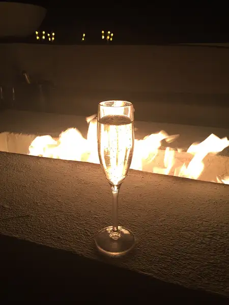 Champagne by the fire pit by JanieBac