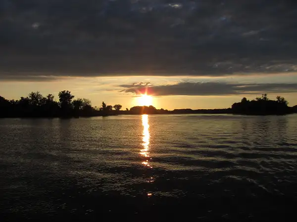 sunset on the river by zippythechipmunk