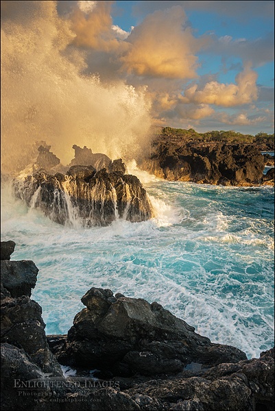 Waves crashing against coastal lava rocks at sunset at The End of the World
