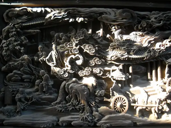 Wood carvings on a temple wall by MauraLydon