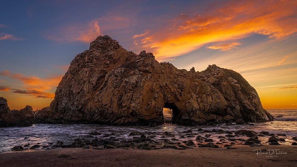 Dramatic Sunset at Pfeiffer Beach Arch, Big Sur California