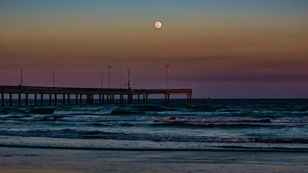 Moonrise at Port Aransas pier by BlackburnImages