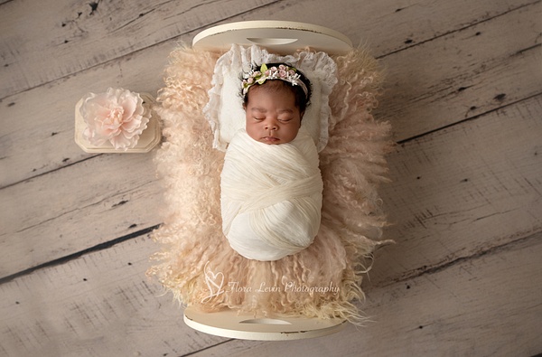Newborn baby  girl on a bedFlora_Levin - Newborn - Flora Levin Photography  