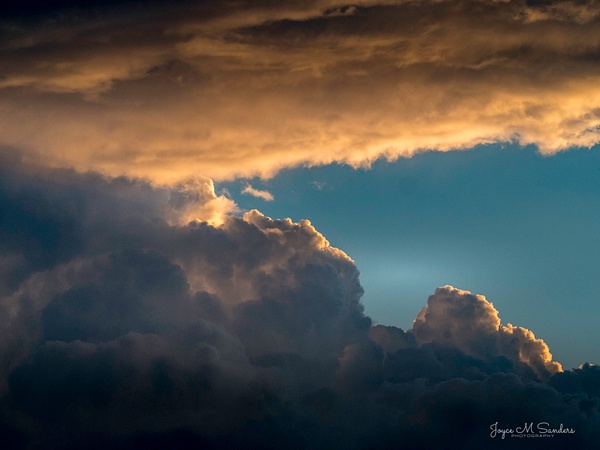 Sunset with large clouds - Joyce M Sanders