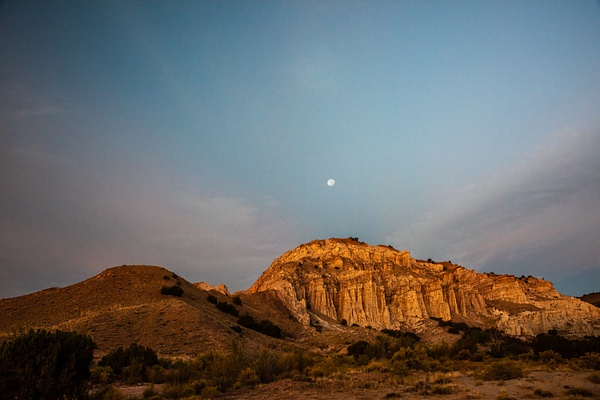 Moon Setting over Sunlit Rocks - New Mexico - Jack Kleinman 