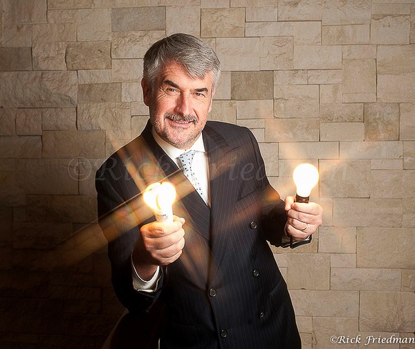 Rudy Provoost, former president  of Phiips holding  aLED light build and a traditional  light bulb  by Rick Friedman - Portraits - Rick Friedman Photography
