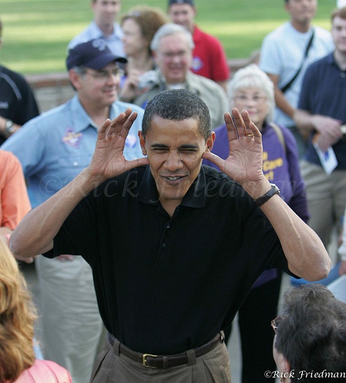 Barack Obama with fingers in his ears reacting to child making a face at him, while in campaigning in NH  by Rick Friedman - Politics - Rick Friedman Photography 