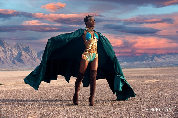 Black model in flowing green cape  in Nevada desert at sunrise by Rick Ferro - Rick & Rick Photo Workshops