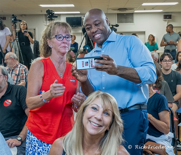Senator Tim Scott taking a selfie while  campaigning for president  in New Hampshire  by Rick Friedman - Rick Friedman Photography 
