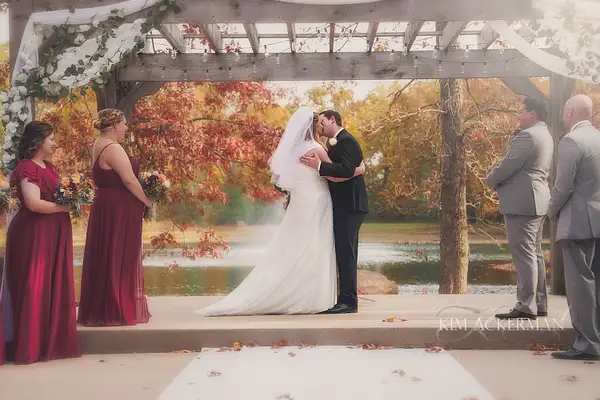 first kiss outdoor wedding by Kim Ackerman
