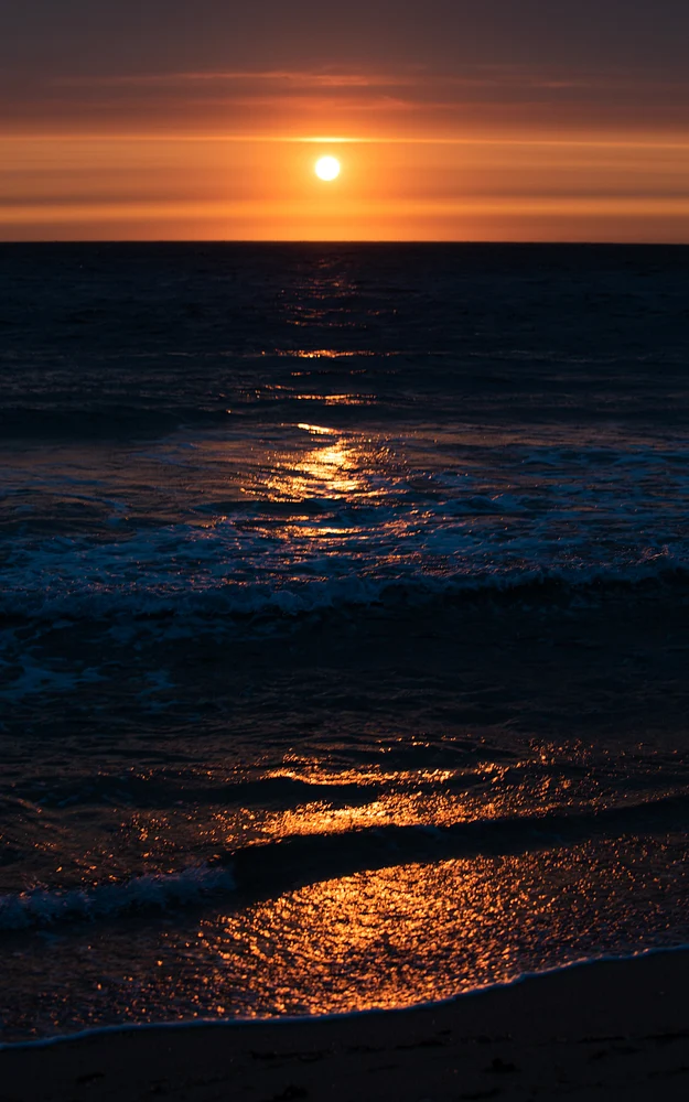 Captivating Cape Cod Sunset Over Ocean Waves