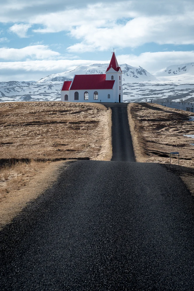 Charming Red Church on Scenic Icelandic Hilltop