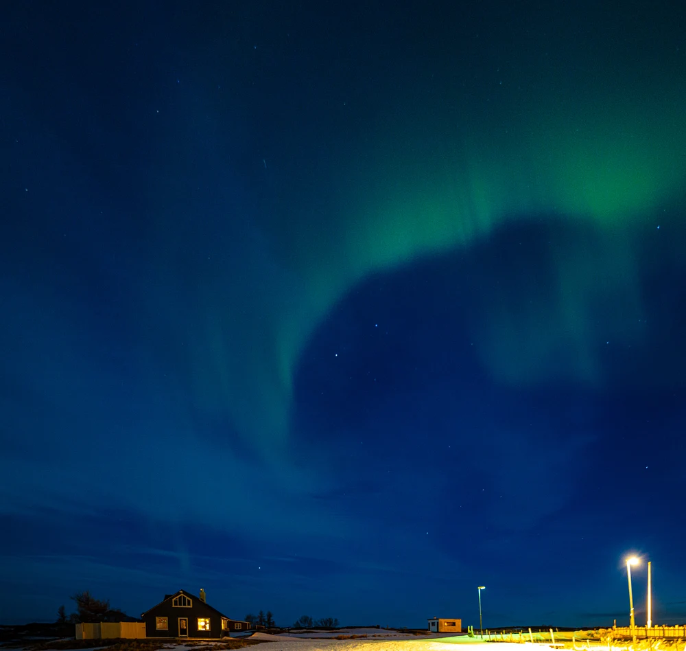 Enchanting Northern Lights Over Icelandic Landscape