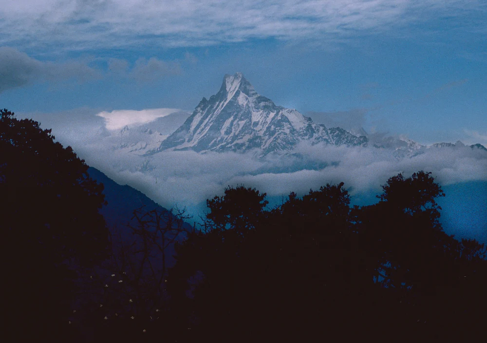 Majestic Machapuchare Peak Shrouded in Clouds