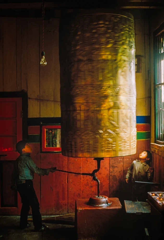 Children Engaging with a Giant Prayer Wheel in 1989
