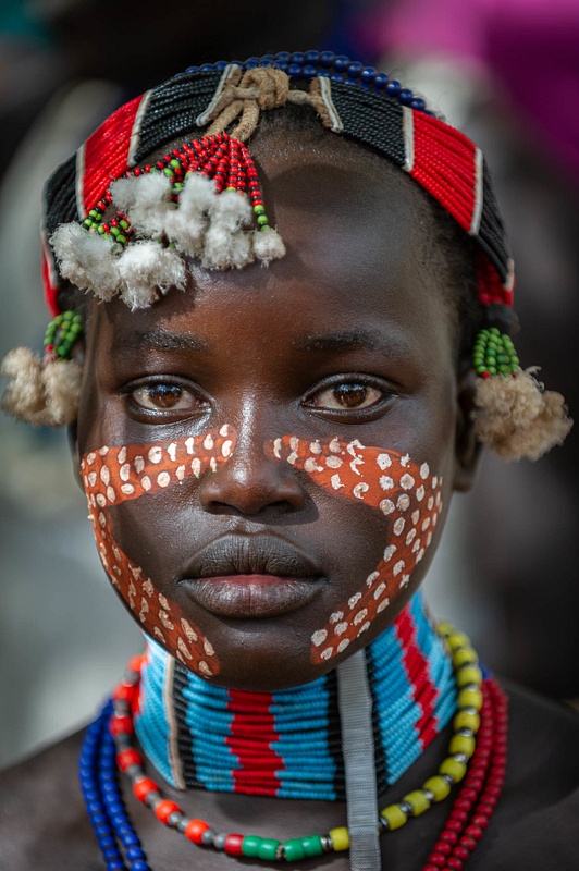 Girl of the Hamar Tribe who just had her face painted for a ceremony in Ethiopia