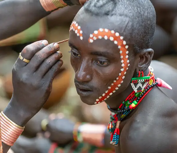 A male of the Hamar (Hamer) tribe having his face...
