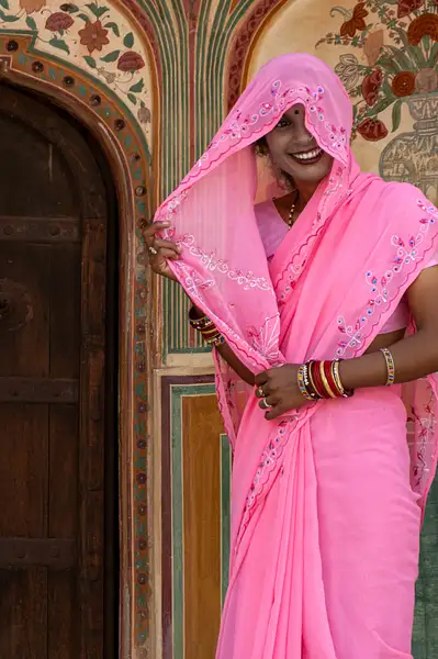 Woman in a colorful saree, India by Ronnie James