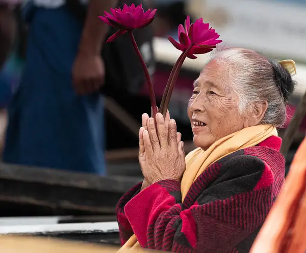 Woman taking in the annual Phaung Daw Oo Pagoda Festival...