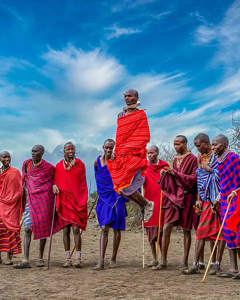 Masai man performs traditional jumping dance,...