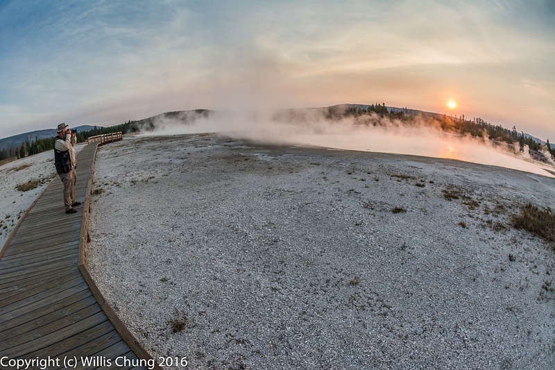 Chris taking another shot of the sun rising over Rainbow Pool, Black Sand Basin, Yellowstone NP