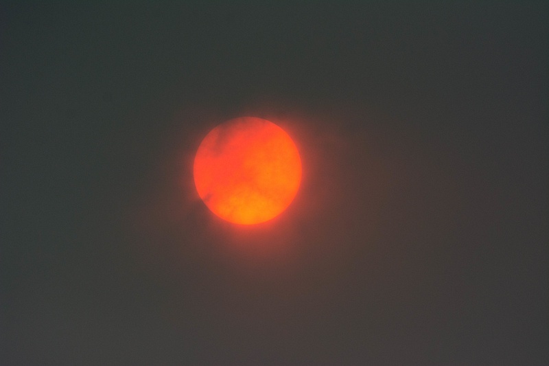 Late afternoon sun with smoke from multiple wildfires
