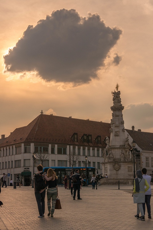 Holy Trinity Statue in Plaza Szentháromság (Trinity Plaza). Sun hiding behind a cloud.