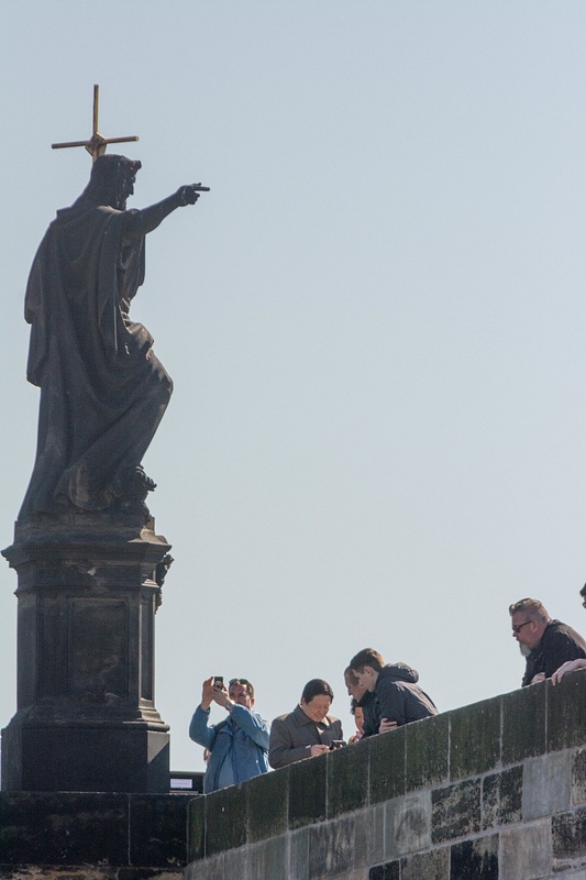 Statue on Charles Bridge looks to be giving  photography advice.
