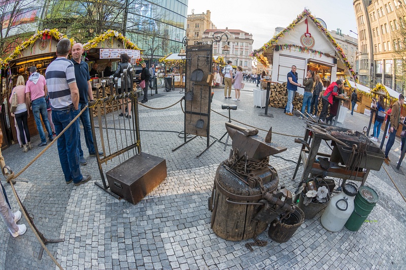 Blacksmith set up in the square, but he is on break, probably getting a kielbasa!