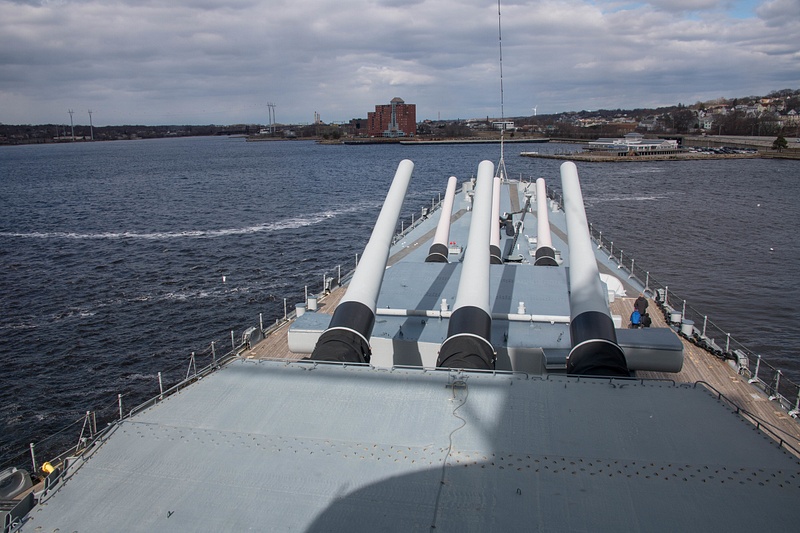 On the deck just above the tops of the main gun turrets.