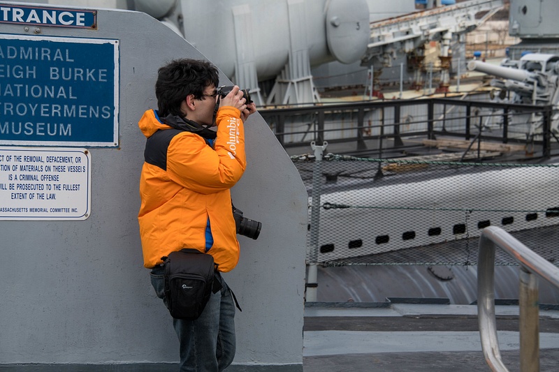 Ben on board the stern of the Joe Kennedy, photographing the rear 5 inch turret