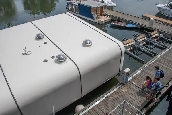 PORT X, A custom container houseboat docked at the...