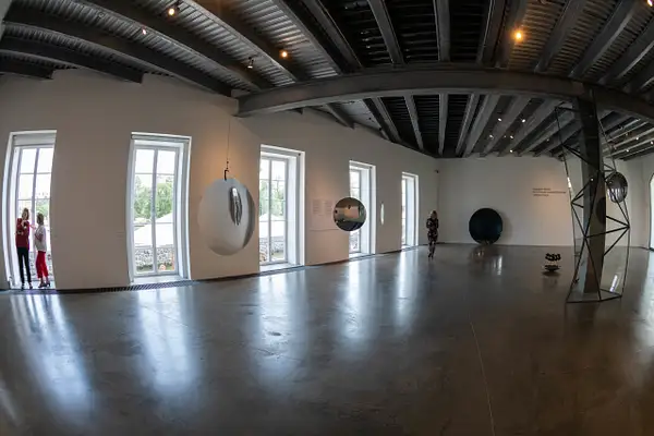 A hall of slowly spinning circular mirrors. Perfect fun...
