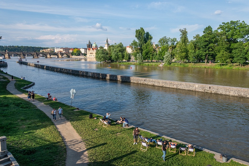 Walking south along the west bank of the Vltava River. Shooter's Island  comes into view.