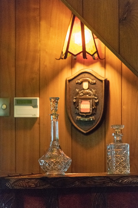 Glass decanters in the Jungle Room.