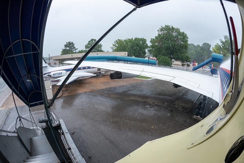 Pouring down rain as we wait in the rear door of Elvis' Convair 880