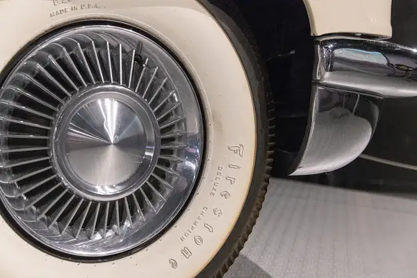 Tire and wheel of the white 1956 Lincoln Continental by...