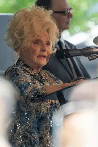 Brenda Lee talking to the crowd in Nashville. by Willis...
