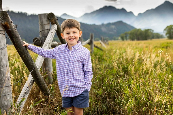 little boy holding onto fence - Flo McCall Photography 