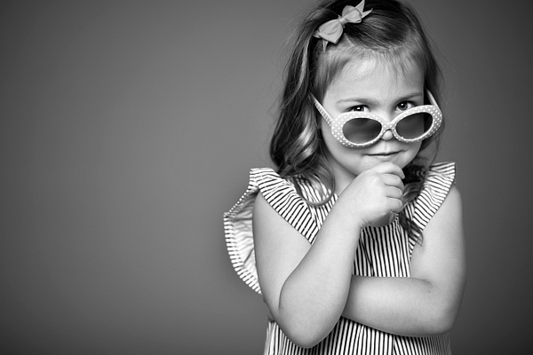 little girl in studio with sunglasses - Flo McCall Photography 
