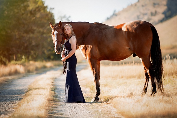 girl in dress with horse on road - Flo McCall Photography