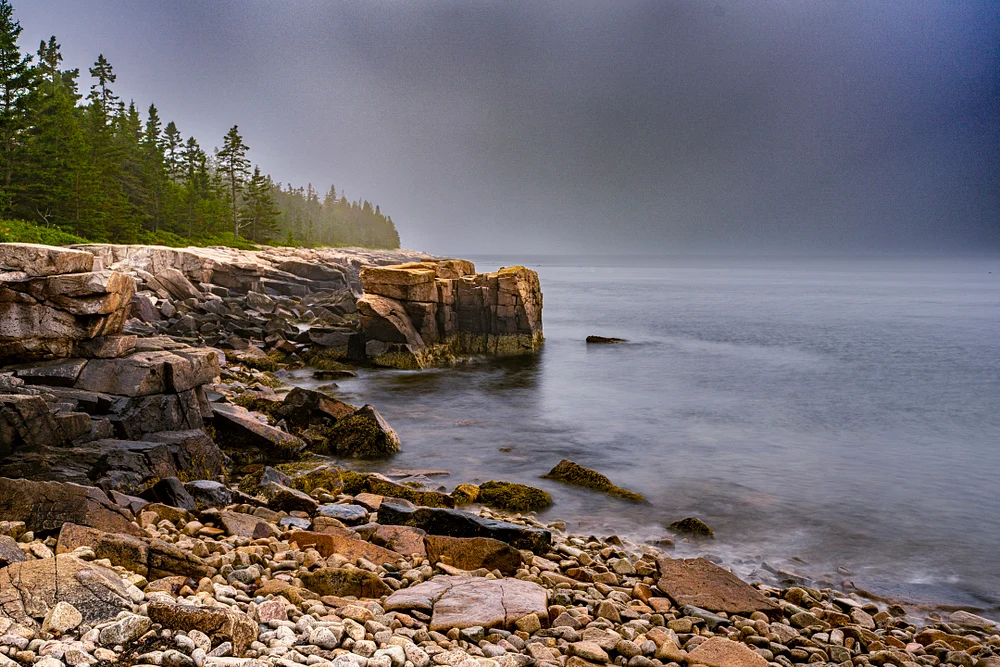 Serene Coastal Cliffs Under Misty Skies
