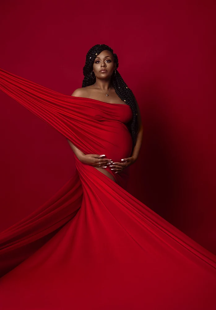 Stunning Maternity Portrait in Red Drapery