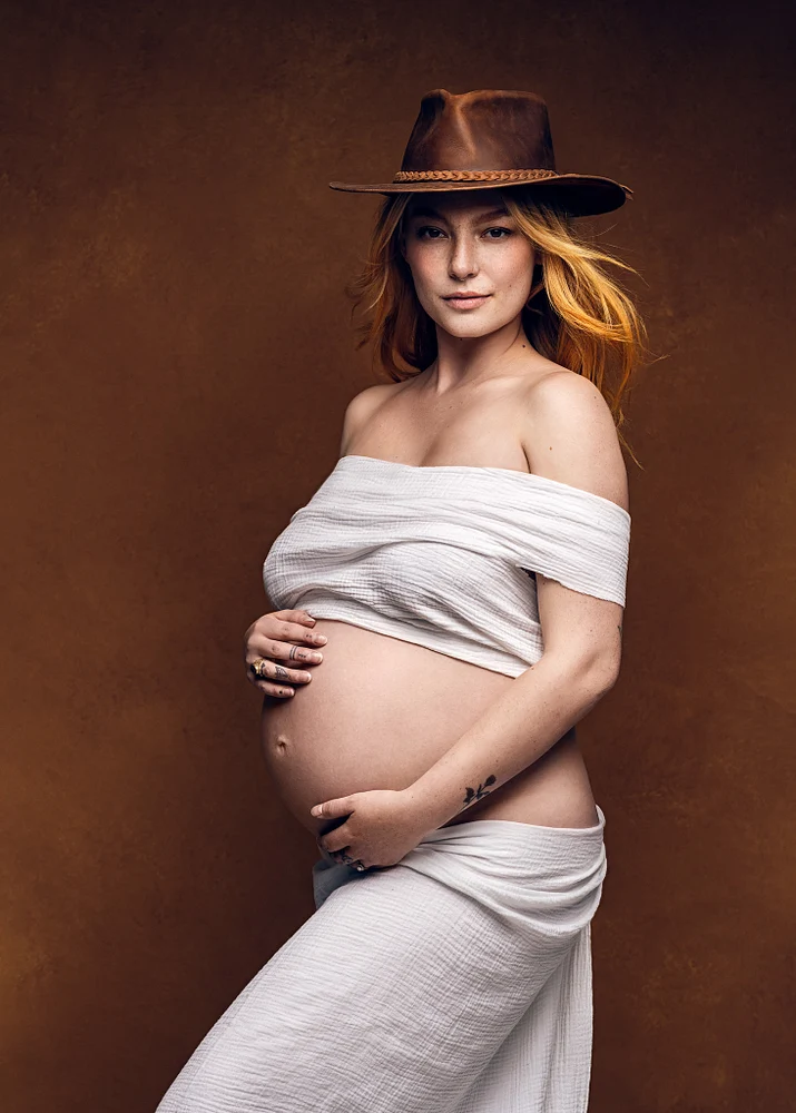 Elegant Maternity Portrait with Rustic Hat