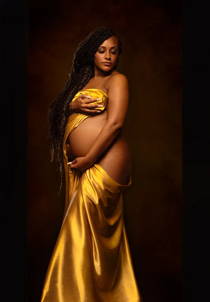 Elegant Maternity Portrait in Golden Drapery