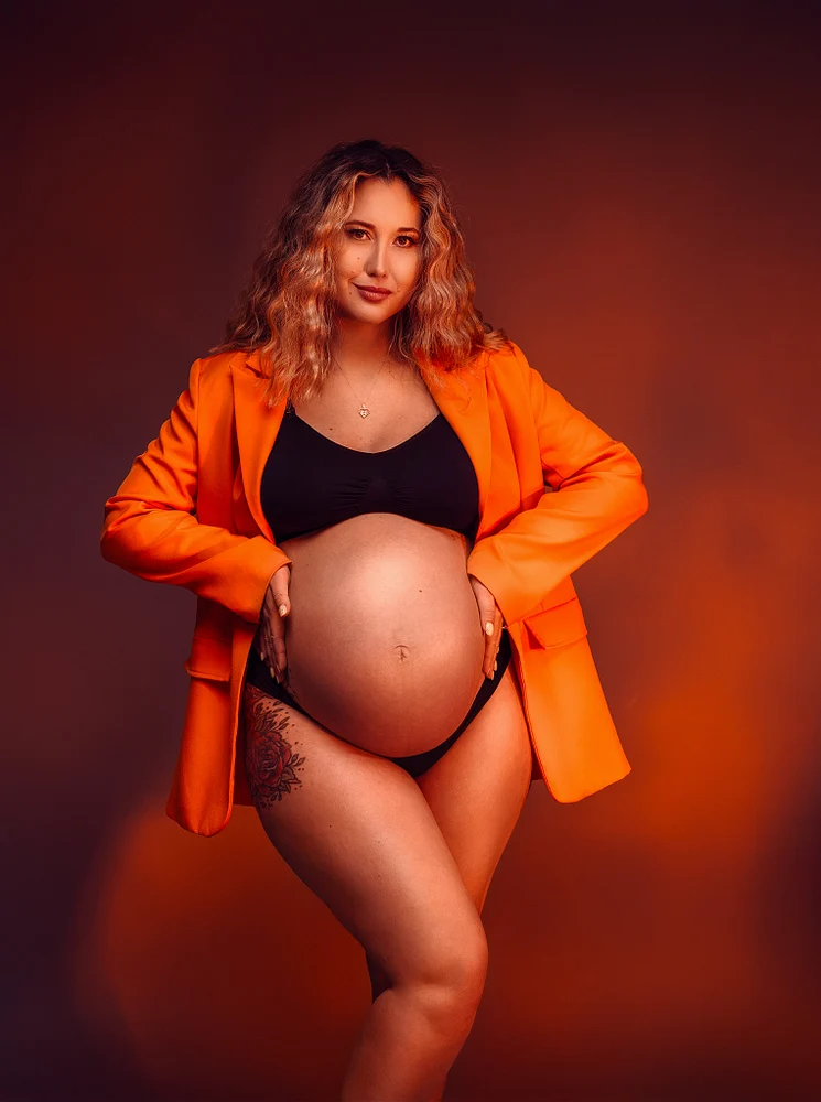 Stunning Maternity Portrait in Vibrant Orange Blazer